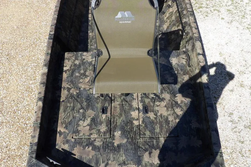 Slide: The Image of 2026 Crestliner 1860 Retriever CC Tunnel boat with camouflage design and seating. - 22