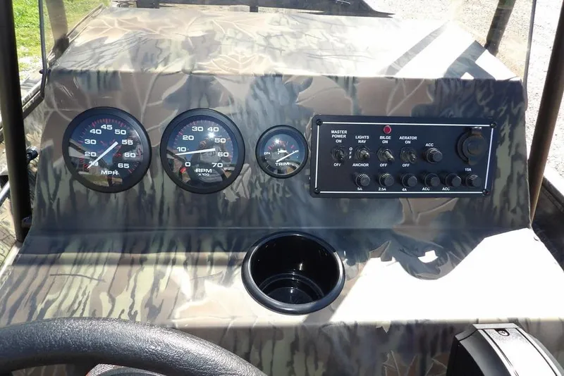 Slide: The Image of Dashboard of 2026 Crestliner 1860 Retriever CC Tunnel with gauges and control panel. - 28