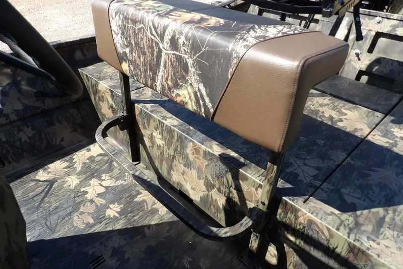 Slide: The Image of Crestliner 1860 Retriever CC Tunnel 2026 boat interior with camouflage seating and flooring. - 33