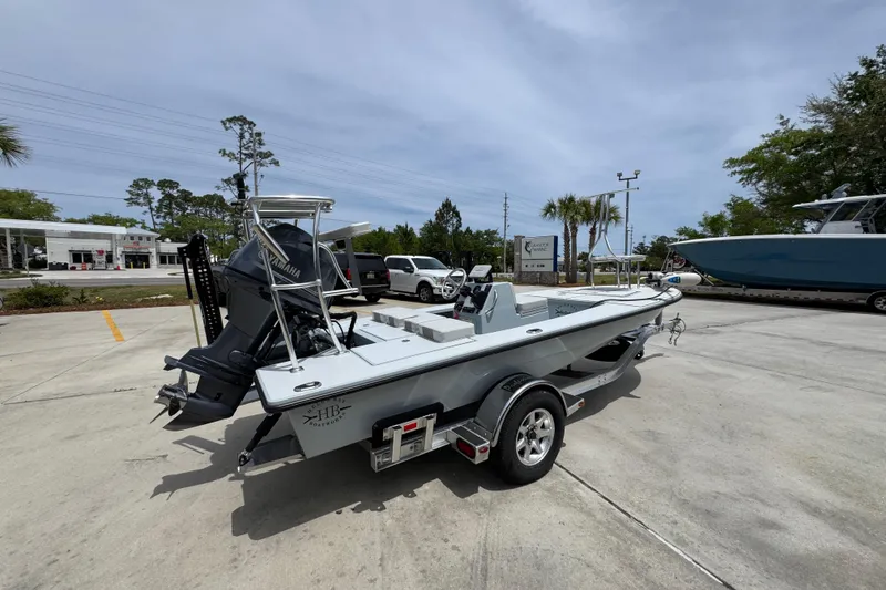Slide: The Image of 2016 Hell's Bay Professional boat on trailer, parked outdoors with Yamaha engine. - 10