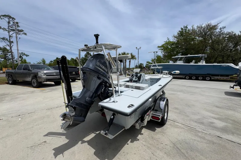 Slide: The Image of 2016 Hell's Bay Professional boat with Yamaha engine on trailer in parking lot. - 11