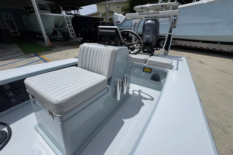 Slide: The Image of 2016 Hell's Bay Professional boat interior with seating and steering console. - 25