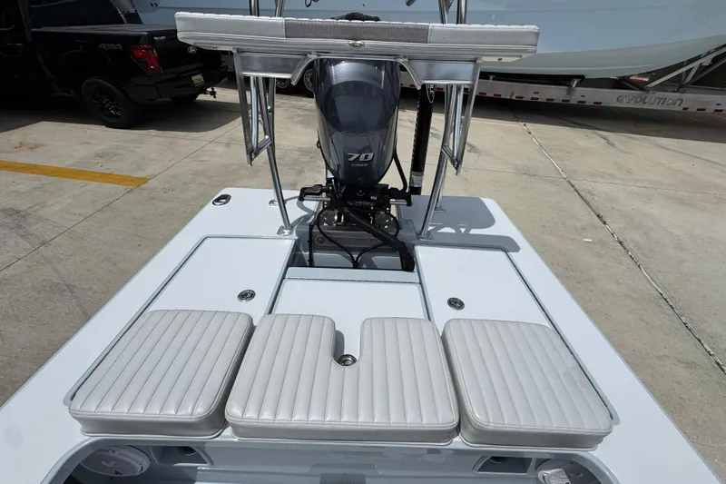 Slide: The Image of 2016 Hell's Bay Professional boat with Yamaha 70 engine and cushioned seating. - 29