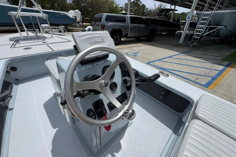 Slide: The Image of 2016 Hell's Bay Professional boat with Garmin navigation system at a marina. - 31