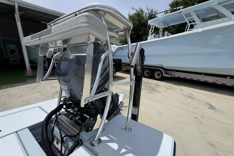 Slide: The Image of 2016 Hell's Bay Professional boat with Yamaha outboard motor and Power-Pole, parked on concrete. - 35