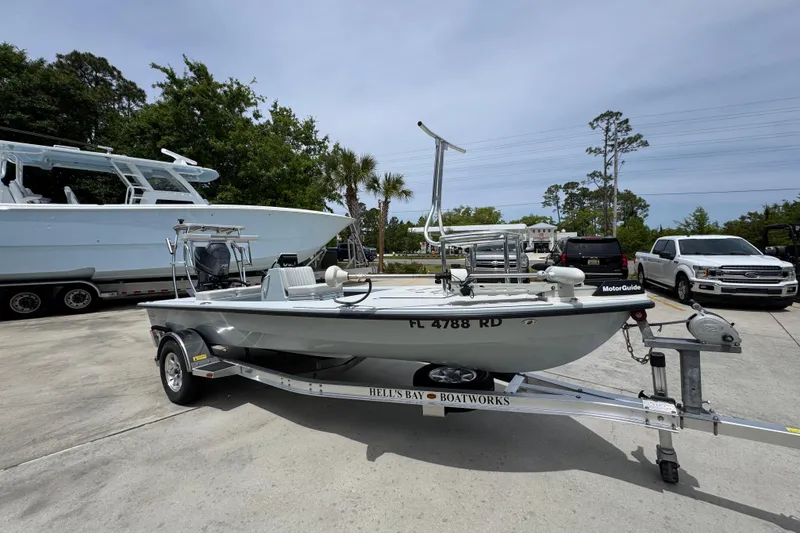 Slide: The Image of 2016 Hell's Bay Professional boat on trailer in parking lot. - 7