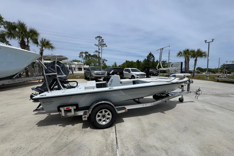 Slide: The Image of 2016 Hell's Bay Professional boat on trailer in outdoor dealership lot. - 9