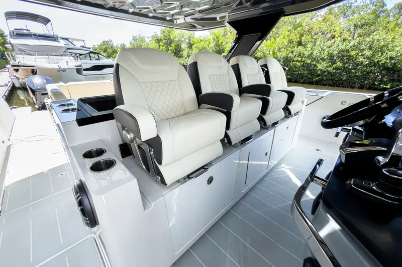 Slide: The Image of Luxurious seating in the cockpit of the 2026 Aquila 45 Sport yacht. - 15