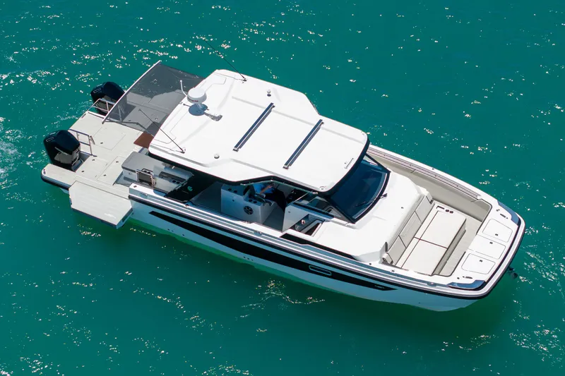 Slide: The Image of Aquila 45 Sport 2026 on turquoise water. - 2