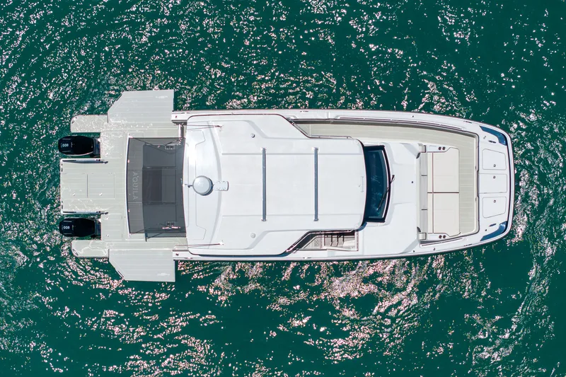Slide: The Image of Aerial view of Aquila 45 Sport Yacht 2026 on the water. - 28