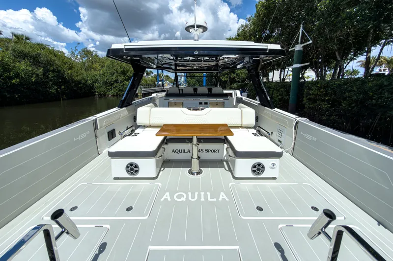 Slide: The Image of Aquila 45 Sport 2026 yacht with luxurious deck and seating area. - 6