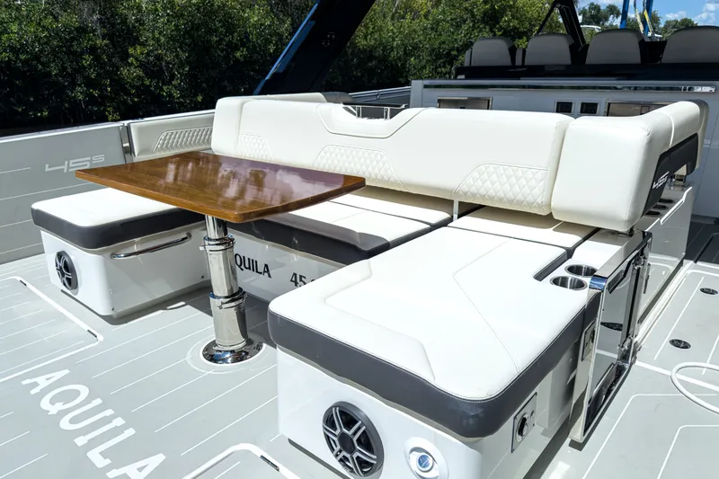 Slide: The Image of Luxurious seating area on the 2026 Aquila 45 Sport yacht. - 7