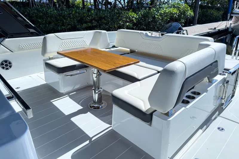 Slide: The Image of Luxurious seating area on the 2026 Aquila 45 Sport yacht. - 9