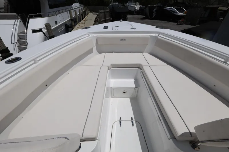 Slide: The Image of 2024 Sea Hunt Gamefish 25 boat interior with spacious seating and storage. - 16