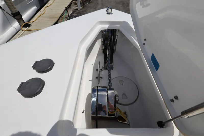 Slide: The Image of 2024 Sea Hunt Gamefish 25 anchor locker with chain and winch system. - 17