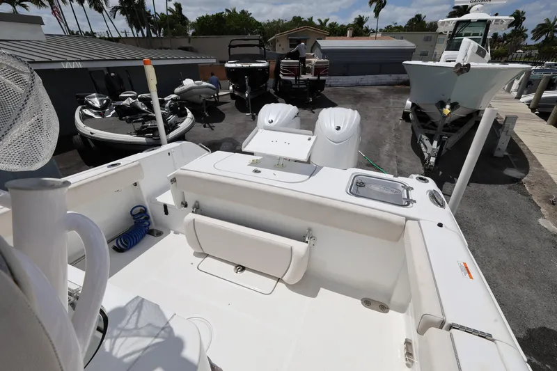 Slide: The Image of 2024 Sea Hunt Gamefish 25 boat interior, featuring spacious deck and modern equipment. - 21