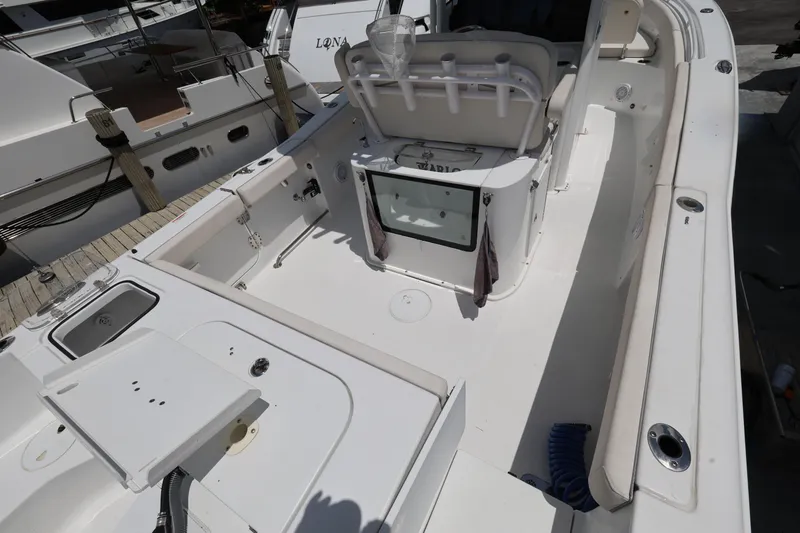 Slide: The Image of 2024 Sea Hunt Gamefish 25 boat interior, featuring spacious deck and fishing amenities. - 9