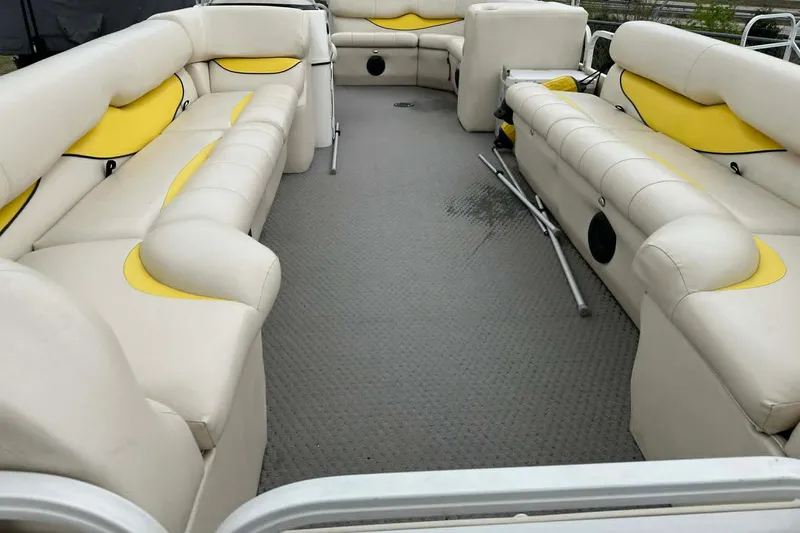 Slide: The Image of 2011 Bentley Pontoons 250/253 Elite Admiral interior with beige and yellow seating. - 11