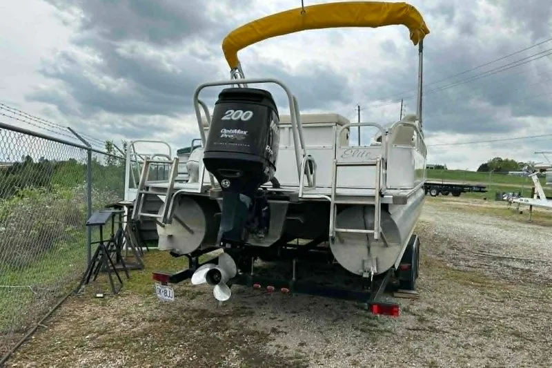 Slide: The Image of 2011 Bentley Pontoons 250/253 Elite Admiral with outboard motor and yellow canopy. - 3