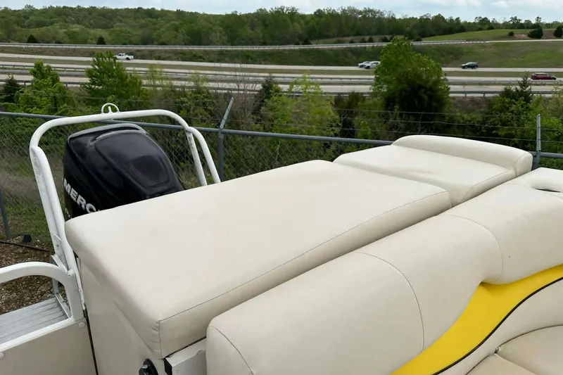 Slide: The Image of 2011 Bentley Pontoons 250/253 Elite Admiral with cushioned seating and Mercury outboard motor. - 9