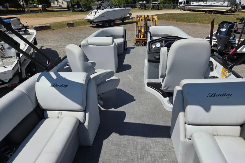 Slide: The Image of 2022 Bentley Pontoons 240 Navigator interior with plush seating and modern dashboard. - 11