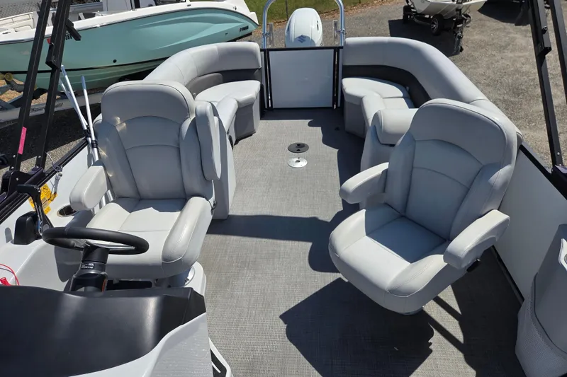 Slide: The Image of 2022 Bentley Pontoons 240 Navigator interior with plush seating and steering console. - 13