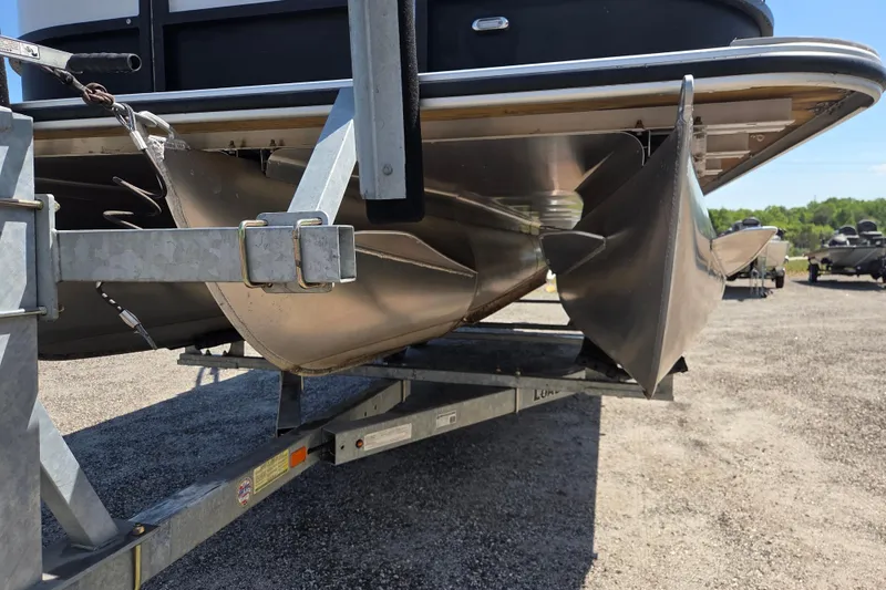 Slide: The Image of 2022 Bentley Pontoons 240 Navigator on trailer, showcasing pontoon structure. - 15