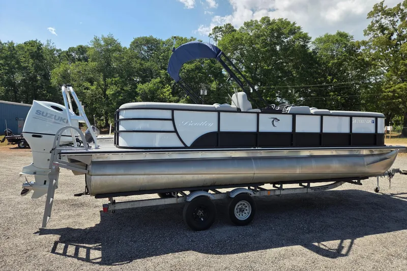 Slide: The Image of 2022 Bentley Pontoons 240 Navigator on trailer with Suzuki outboard motor. - 4