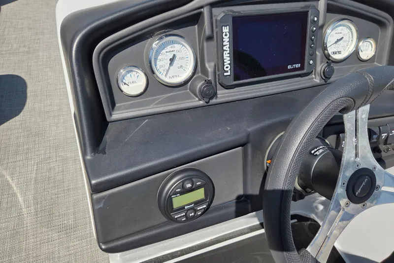 Slide: The Image of Dashboard of 2022 Bentley Pontoons 240 Navigator with gauges and Lowrance Elite display. - 7