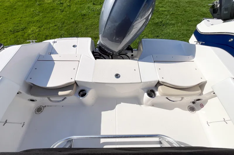 Slide: The Image of 2018 Robalo R180 Center Console boat interior with seating and motor, viewed from above. - 6