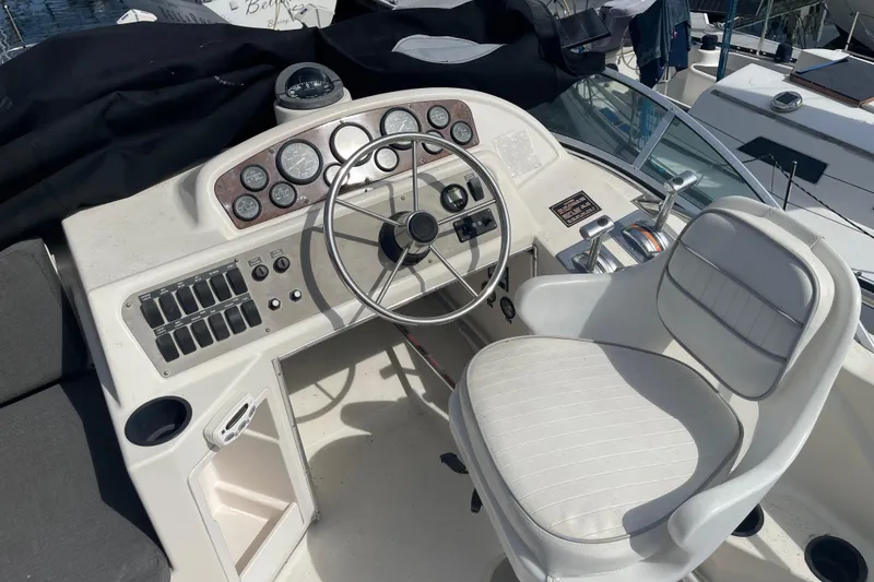 Slide: The Image of Cockpit of 1996 Bayliner 3255 Avanti with steering wheel and control panel. - 10