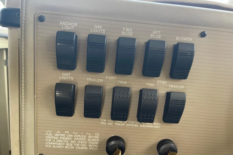 Slide: The Image of Control panel of a 1996 Bayliner 3255 Avanti boat with various switches. - 17