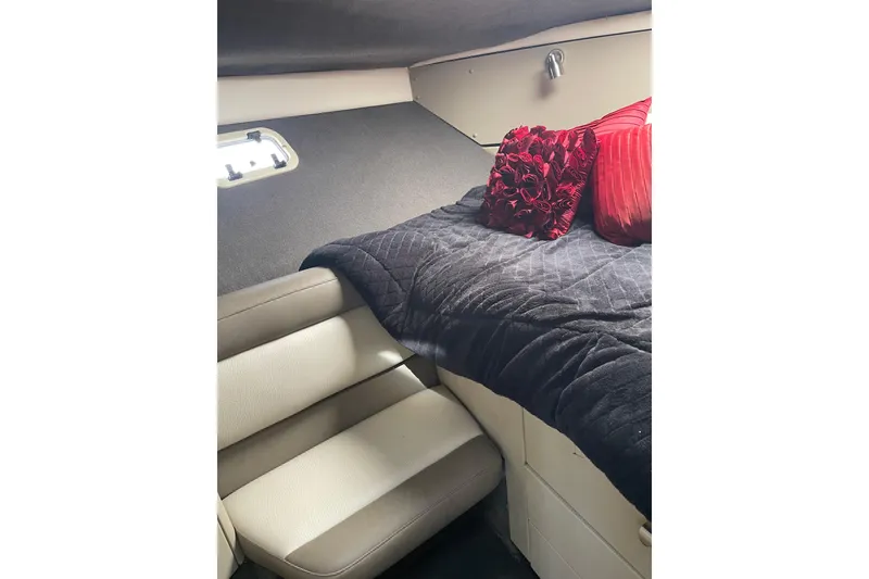 Slide: The Image of Interior cabin of 1996 Bayliner 3255 Avanti with plush bedding and seating. - 21