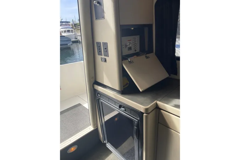 Slide: The Image of Interior view of a 1996 Bayliner 3255 Avanti boat with control panel and cabinetry. - 31