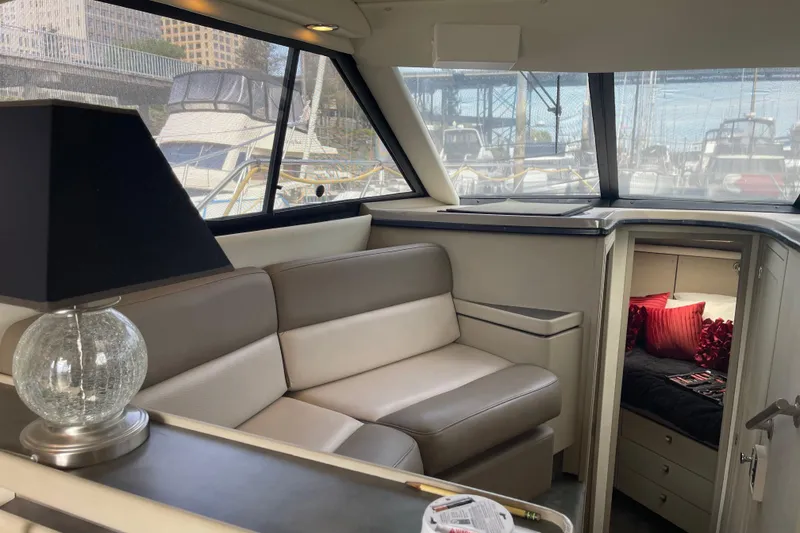 Slide: The Image of Interior of a 1996 Bayliner 3255 Avanti yacht with sofa and cabin view. - 36