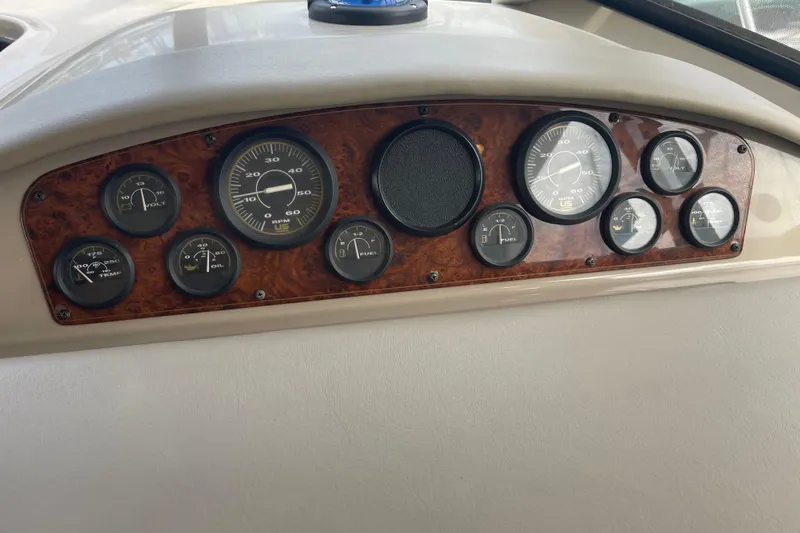 Slide: The Image of Dashboard of a 1996 Bayliner 3255 Avanti boat with various gauges. - 39