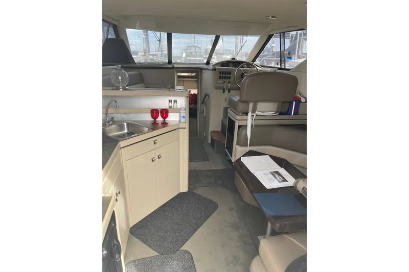 Slide: The Image of Interior of 1996 Bayliner 3255 Avanti boat with kitchenette and helm station. - 41