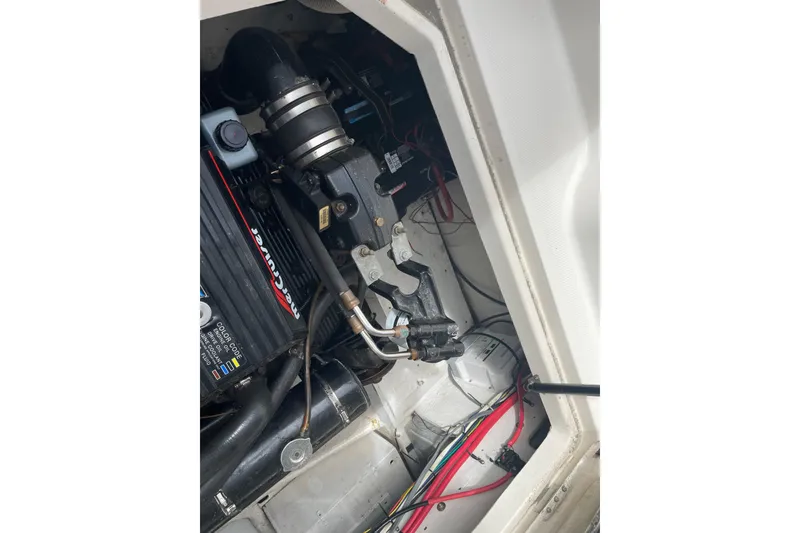 Slide: The Image of Engine compartment of a 1996 Bayliner 3255 Avanti boat, featuring MerCruiser components. - 43