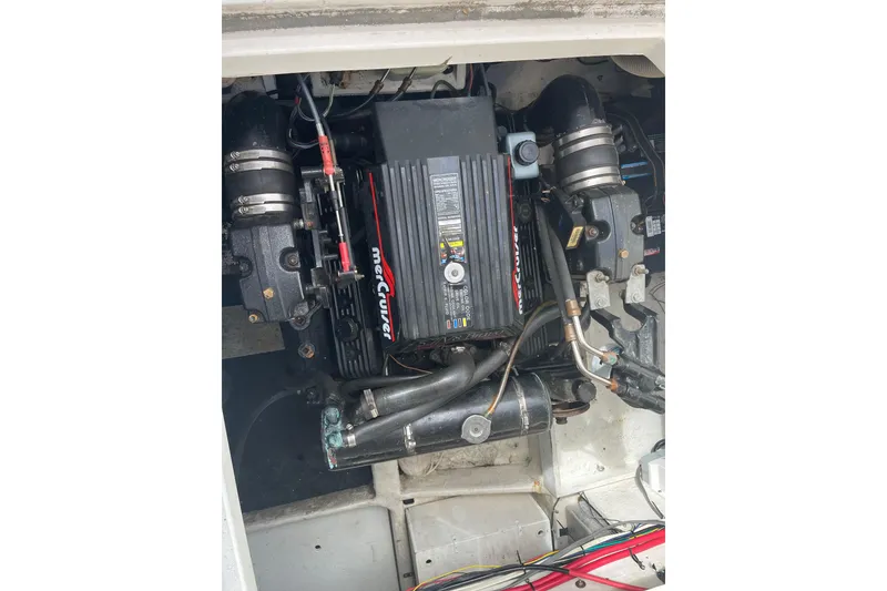 Slide: The Image of Engine compartment of a 1996 Bayliner 3255 Avanti boat, featuring a MerCruiser engine. - 44