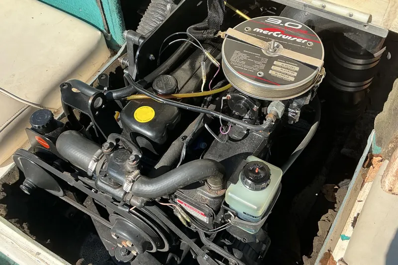 Slide: The Image of Engine of a 1998 Sea Ray 175 Bow Rider boat, featuring a MerCruiser 3.0L. - 12