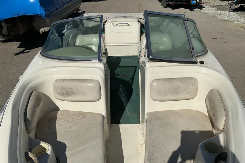Slide: The Image of 1998 Sea Ray 175 Bow Rider boat interior with open windshield and seating. - 5