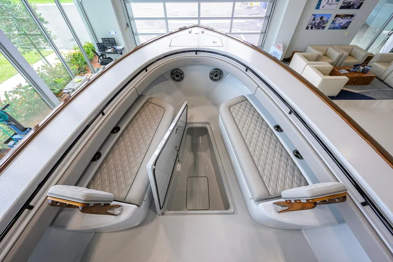 Slide: The Image of 2026 Valhalla Boatworks V-37 interior with cushioned seating and storage compartment. - 12
