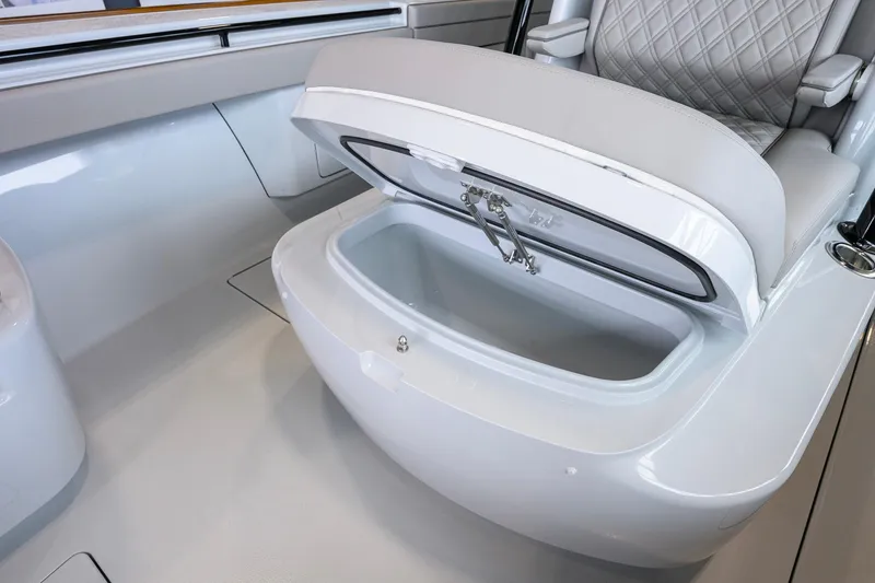 Slide: The Image of 2026 Valhalla Boatworks V-37 seat storage compartment, open with cushioned seating. - 15
