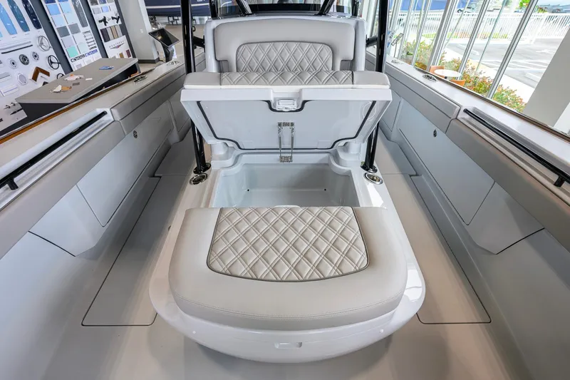 Slide: The Image of 2026 Valhalla Boatworks V-37 interior with luxurious seating and storage compartment. - 16