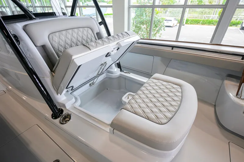 Slide: The Image of 2026 Valhalla Boatworks V-37 interior with luxurious seating and storage compartment. - 17