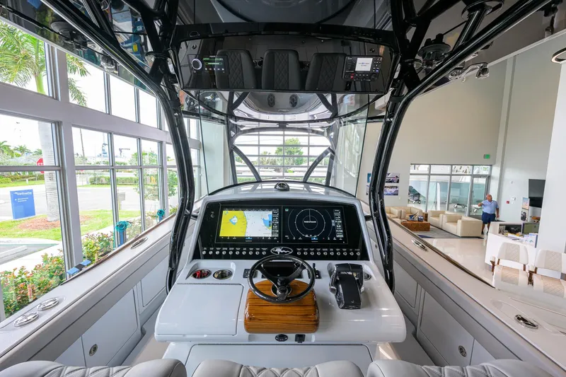 Slide: The Image of Interior view of 2026 Valhalla Boatworks V-37 helm with advanced navigation system. - 18