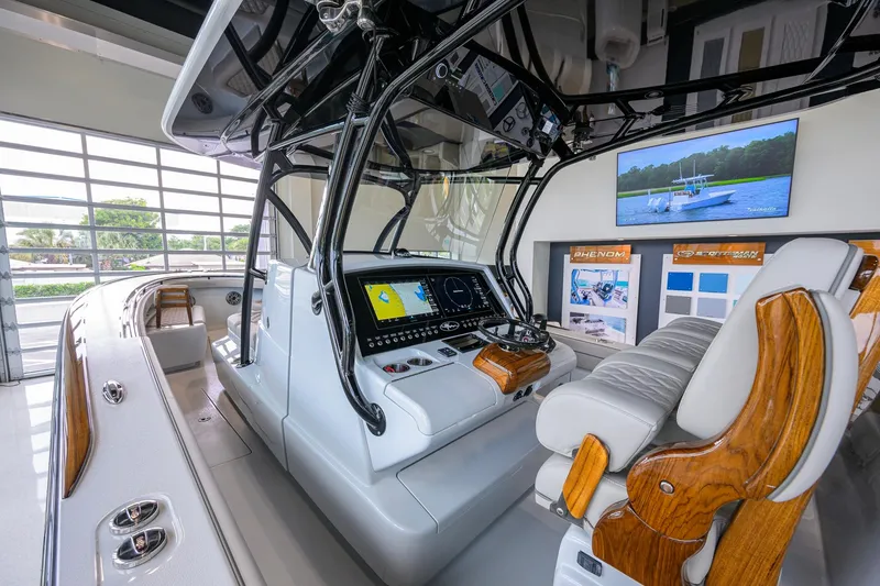Slide: The Image of 2026 Valhalla Boatworks V-37 interior with advanced navigation system and luxurious seating. - 19