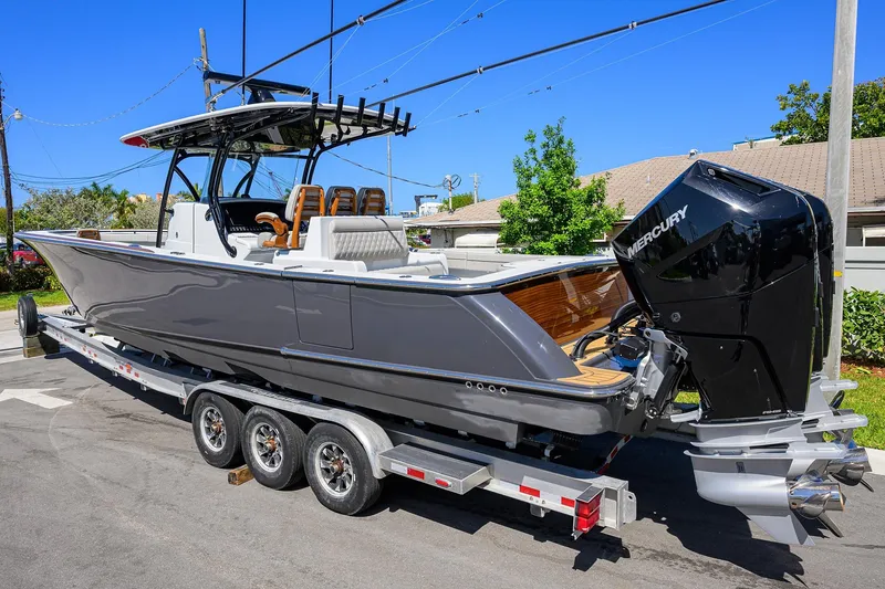 Slide: The Image of 2026 Valhalla Boatworks V-37 on trailer, featuring sleek design and powerful Mercury engine. - 2