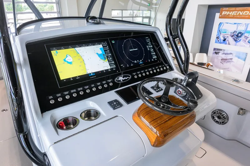 Slide: The Image of 2026 Valhalla Boatworks V-37 helm with advanced navigation display and controls. - 21