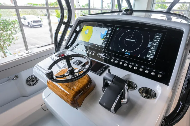 Slide: The Image of 2026 Valhalla Boatworks V-37 helm with advanced navigation displays and controls. - 22